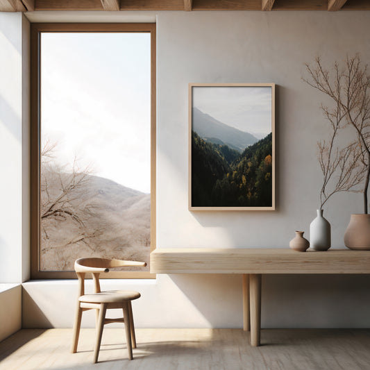Analog forest mountain valley landscape print with autumn tones, shot on 35mm film in the Swiss Alps, displayed in a wooden frame in a minimalist Japandi style interior with natural light