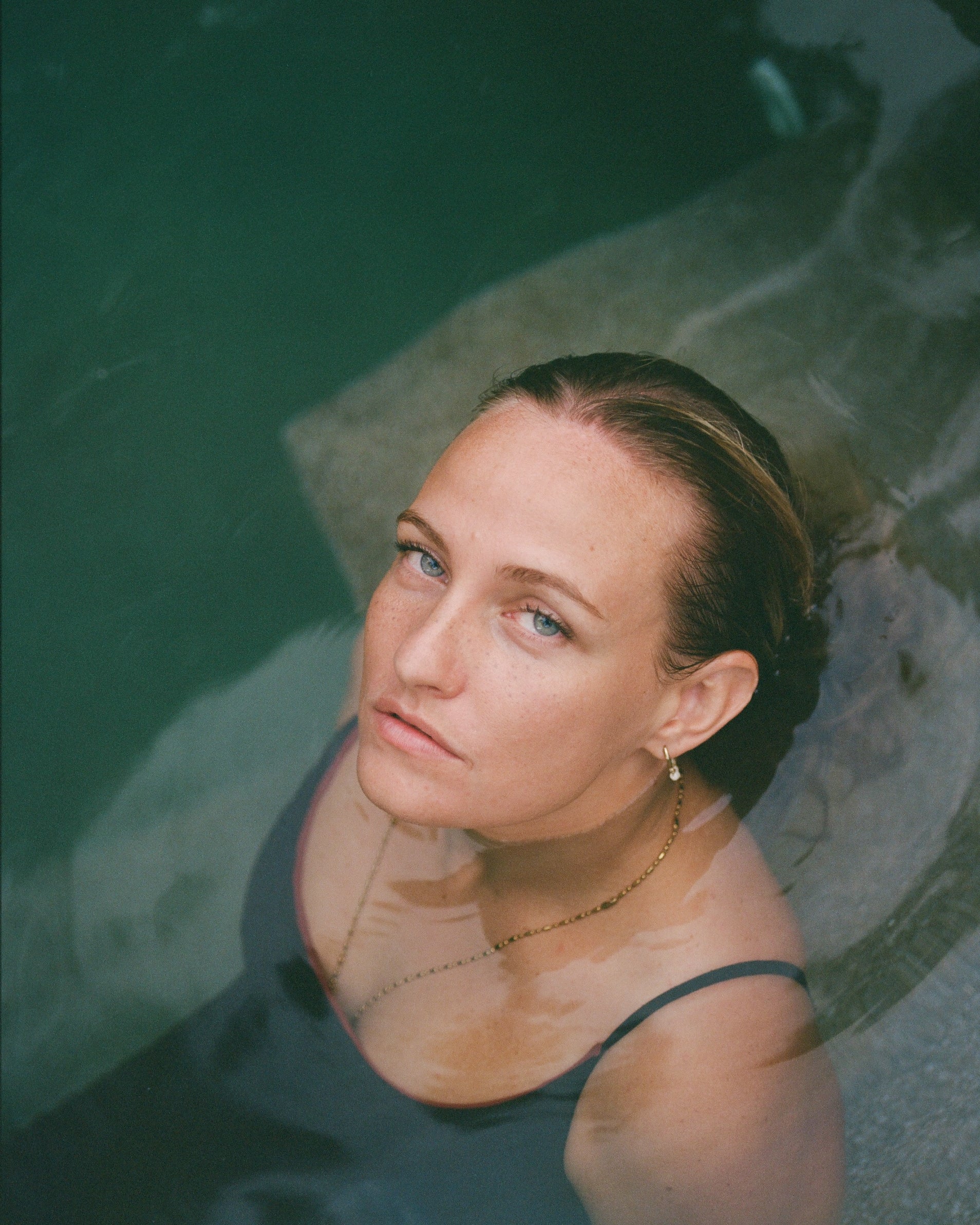 Woman in a pool with water up to her shoulders shot on 120mm Sri Lanka