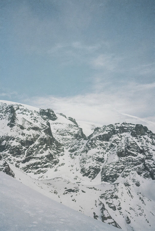 Analog film photograph of the Breithorn mountain in the Swiss Alps, soft winter light falling across snow-covered peaks — first in a three-part series.