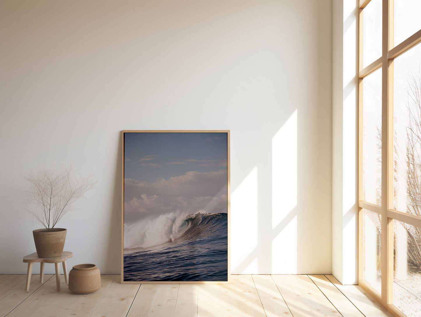 Analog ocean wave print of powerful breaking surf teahupo'o Tahiti, shot on 35mm film, displayed in a wooden frame in a bright minimalist interior with natural light