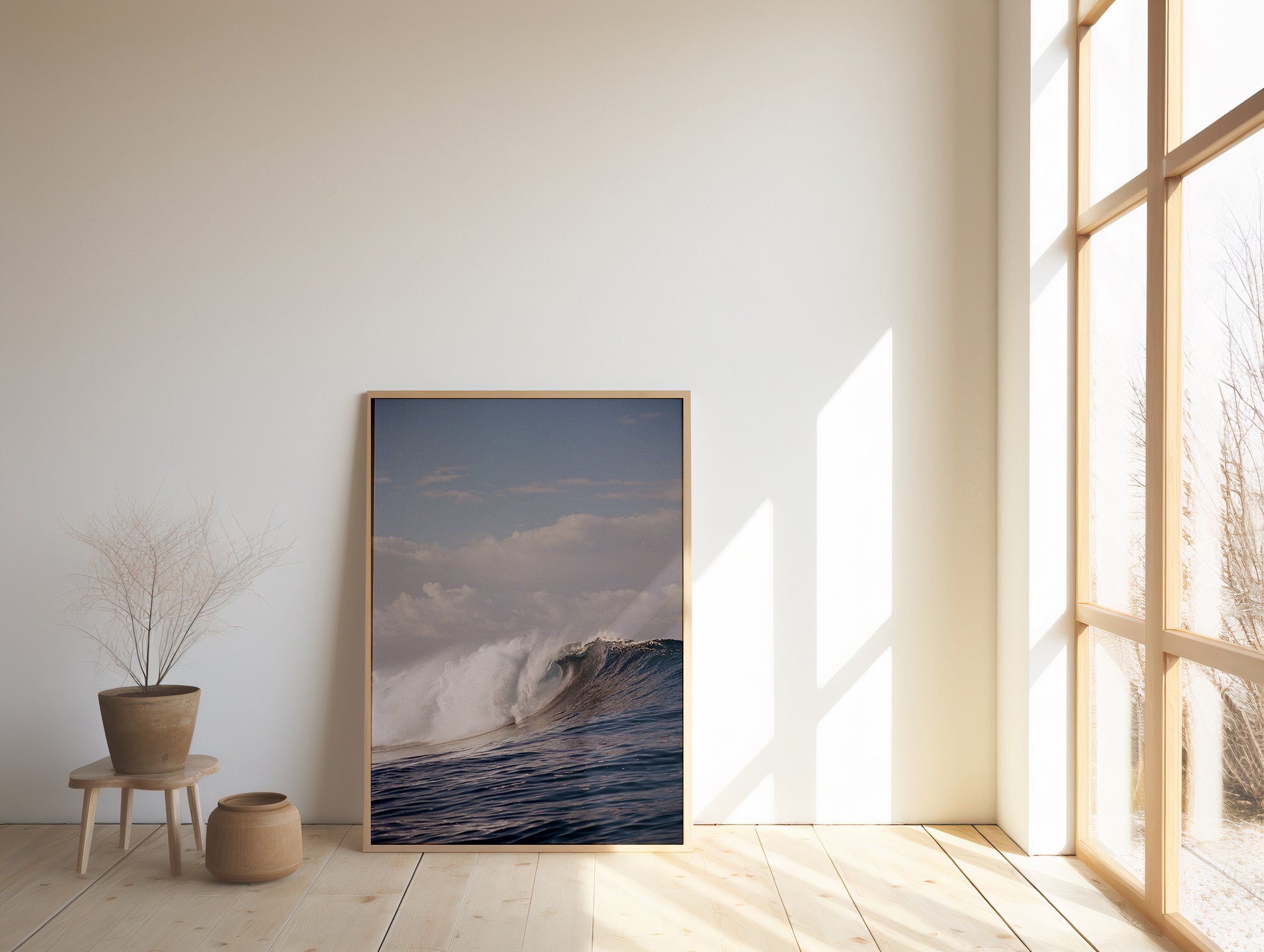 Analog ocean wave print of powerful breaking surf teahupo'o Tahiti, shot on 35mm film, displayed in a wooden frame in a bright minimalist interior with natural light