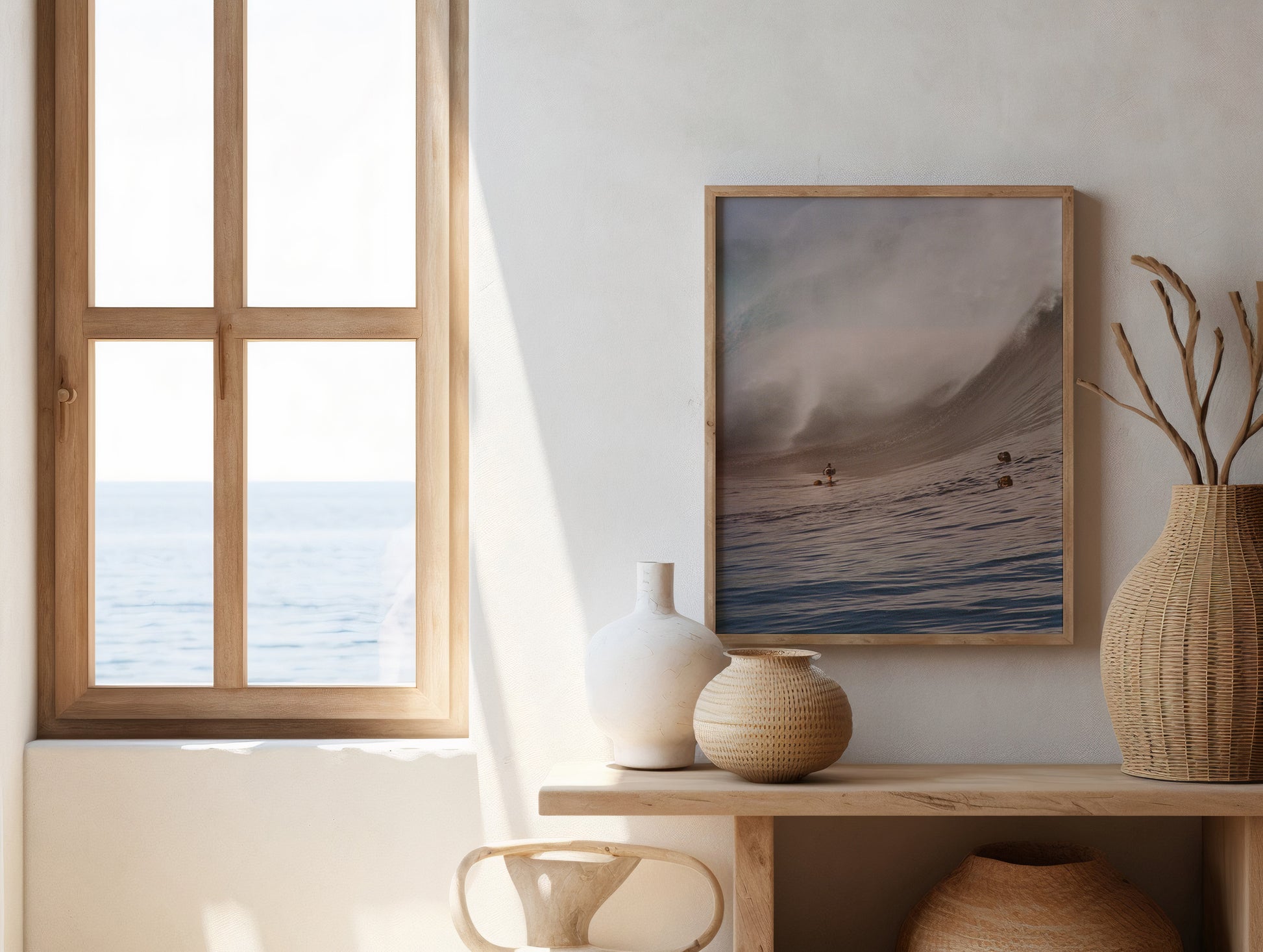 Analog ocean wave print of Teahupo’o with photographers in the water capturing breaking surf, shot on 35mm film, displayed in a wooden frame in a bright coastal minimalist interior