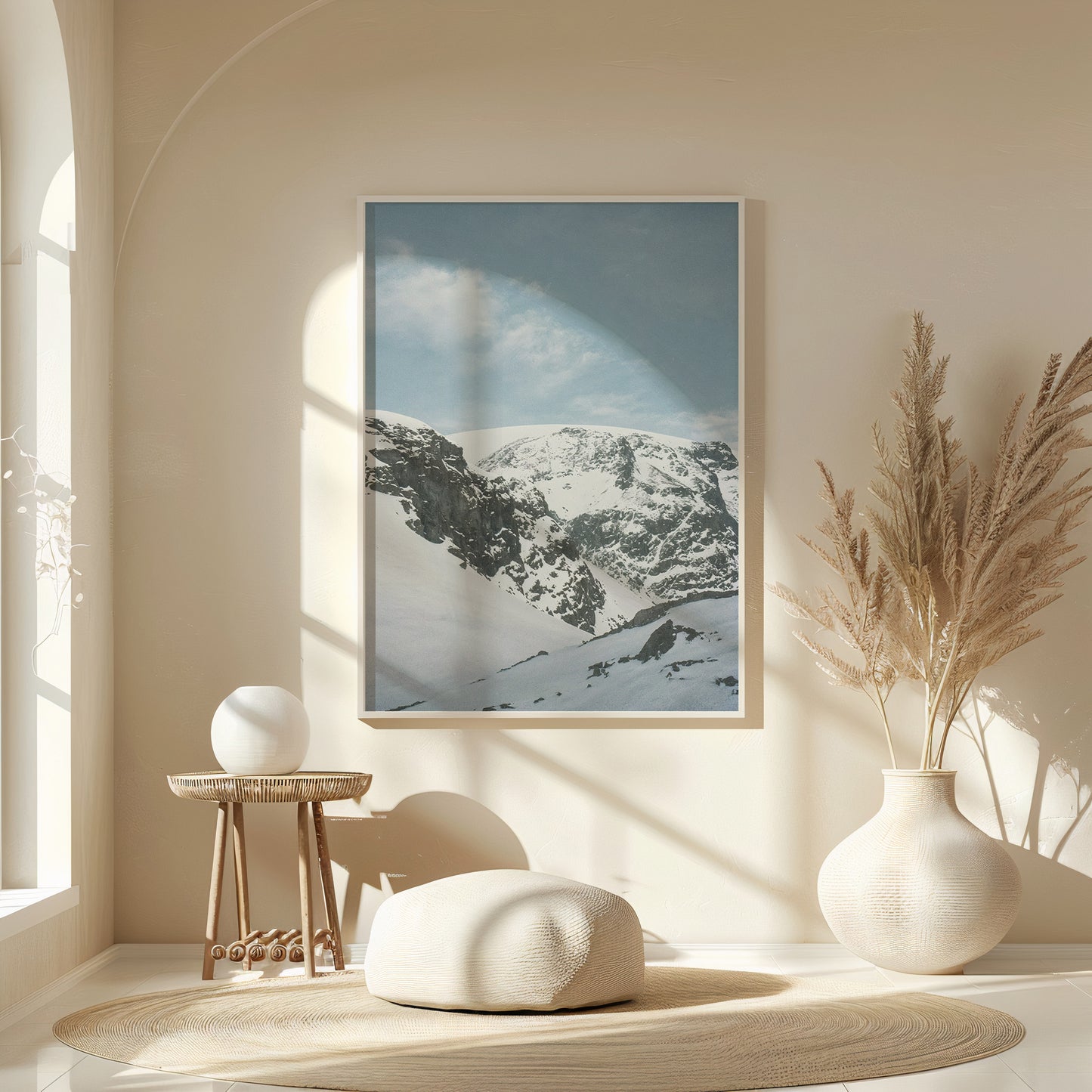 Minimalist interior with a framed snow-covered mountain landscape print in soft blue tones, styled above a wooden console with ceramic vases and natural light, fine art analog photography print shot on 35mm film