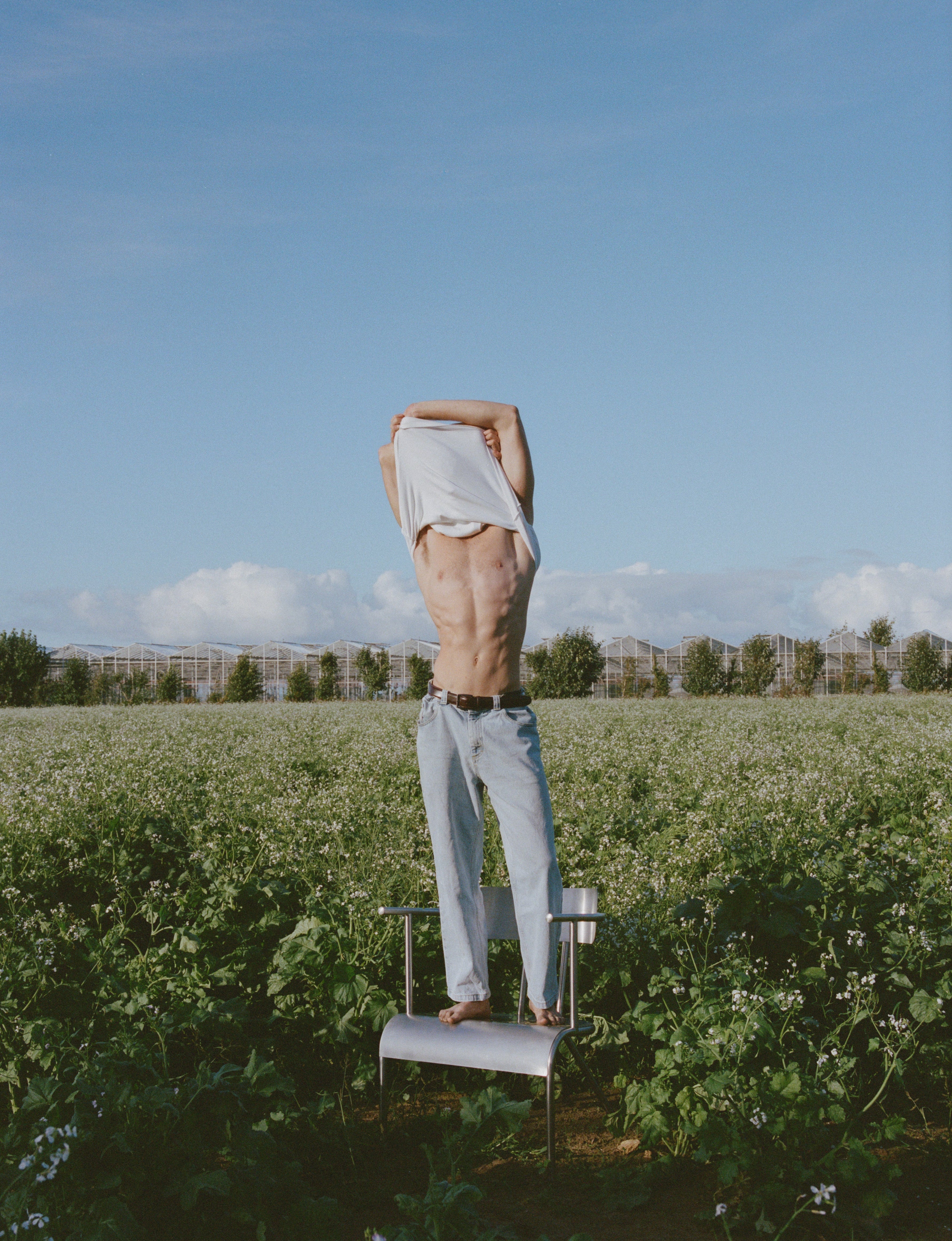 medium format photography, editorial model in flower field